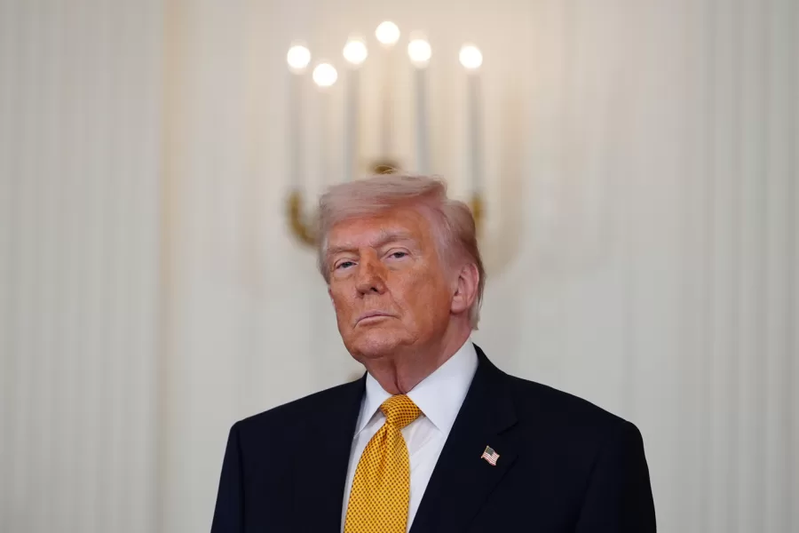President Donald Trump, with first lady Melania Trump, not shown, attends an event for military mothers in the East Room of the White House, Wednesday, May 6, 2026, in Washington. (AP Photo/Julia Demaree Nikhinson)