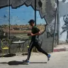 A man runs past the Israel’s separation wall as he competes in the Palestine Marathon in the West Bank city of Bethlehem, Friday, May 8, 2026. (AP Photo/Mahmoud Illean)
Associate Press/ LaPresse
Only Italy and Spain A man runs past the Israel’s separation wall as he competes in the Palestine Marathon in the West Bank city of Bethlehem, Friday, May 8, 2026. (AP Photo/Mahmoud Illean)
Associate Press/ LaPresse
Only Italy and Spain