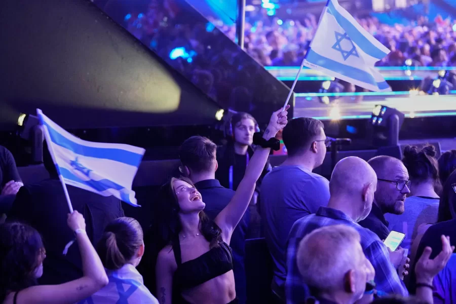 Israeli fans wave their countries flag as they wait for the start of the first semifinal of the 70th Eurovision Song Contest in Vienna, Austria, Tuesday, May 12, 2026. (AP Photo/Martin Meissner)