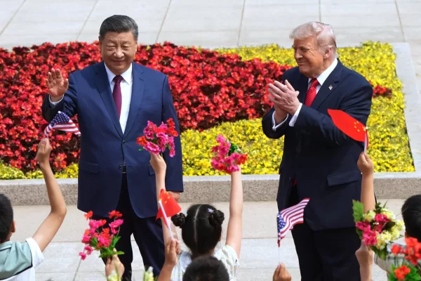 President Donald Trump and China’s President Xi Jinping greet children during a welcome ceremony at the Great Hall of the People, Thursday, May 14, 2026, in Beijing. (AP Photo/Mark Schiefelbein)