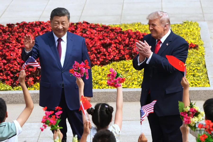 President Donald Trump and China’s President Xi Jinping greet children during a welcome ceremony at the Great Hall of the People, Thursday, May 14, 2026, in Beijing. (AP Photo/Mark Schiefelbein)