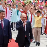 Russian President Vladimir Putin, center, and Chinese President Xi Jinping attend a welcome ceremony at the Great Hall of the People, in Beijing, China, on Wednesday, May 20, 2026. (Alexander Kazakov, Sputnik, Kremlin Pool Photo via AP)