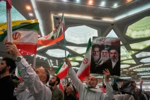 A man holds a sign depicting, from left, the late Iranian revolutionary founder Ayatollah Ruhollah Khomeini, the late Supreme Leader Ayatollah Ali Khamenei, and current Supreme Leader Ayatollah Mojtaba Khamenei during a ceremony honoring the armed forces and those killed in the war with Israel and the U.S. at the Imam Khomeini Grand Mosque in Tehran, Iran, Sunday, May 24, 2026. (AP Photo/Vahid Salemi) A man holds a sign depicting, from left, the late Iranian revolutionary founder Ayatollah Ruhollah Khomeini, the late Supreme Leader Ayatollah Ali Khamenei, and current Supreme Leader Ayatollah Mojtaba Khamenei during a ceremony honoring the armed forces and those killed in the war with Israel and the U.S. at the Imam Khomeini Grand Mosque in Tehran, Iran, Sunday, May 24, 2026. (AP Photo/Vahid Salemi)