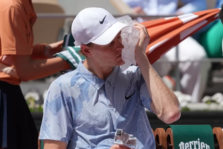 Jannik Sinner of Italy cools himself with the ice during the second round men’s singles tennis match against Juan Manuel Cerundolo of Argentina at the French Open tennis tournament in Paris, Thursday, May 28, 2026. (AP Photo/Thibault Camus)