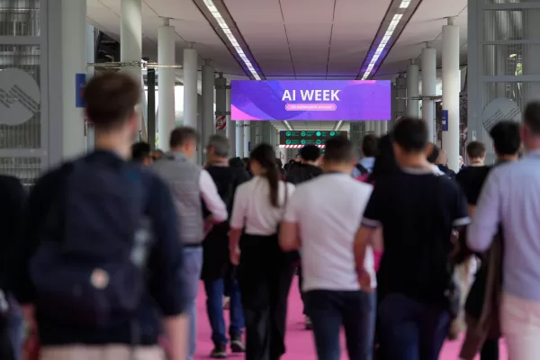 Visitors arrive to the Europelargest artificial intelligence event, AI Week 2026, in Rho, near Milan, Italy, Tuesday, May 19, 2026. (AP Photo/Luca Bruno)
