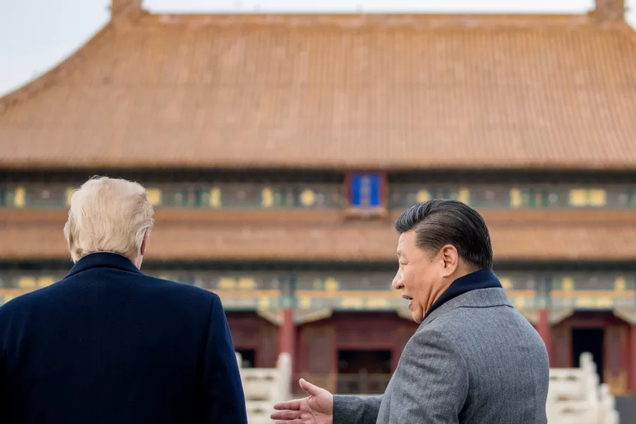 FILE – President Donald Trump and Chinese President Xi Jinping speak together as they tour the Forbidden City, Nov. 8, 2017, in Beijing, China. (AP Photo/Andrew Harnik, File)