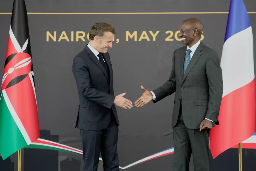 French President Emmanuel Macron, left, and Kenyan President William Ruto shake hands at State House in Nairobi, Kenya, Sunday, May 10, 2026. (AP Photo/Brian Inganga)