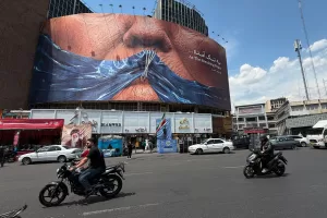 Vehicles drive past a billboard with graphic showing Strait of Hormuz and sewn lips of U.S. President Donald Trump in a square in downtown Tehran, Iran, Saturday, May 2, 2026. (AP Photo/Vahid Salemi)





Associate Press/ LaPresse
Only Italy and Spain