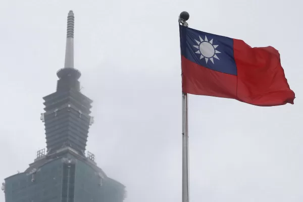 FILE – A Taiwan national flag flutters near the Taipei 101 building at the National Dr. Sun Yat-Sen Memorial Hall in Taipei, Taiwan, May 7, 2023. (AP Photo/Chiang Ying-ying, File)