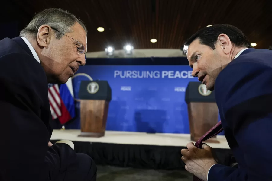 Secretary of State Marco Rubio shows his tie to Russia’s Foreign Minister Sergey Lavrov before a news conference with President Donald Trump and Russia’s President Vladimir Putin at Joint Base Elmendorf-Richardson, Alaska, Friday, Aug. 15, 2025. (AP Photo/Julia Demaree Nikhinson)