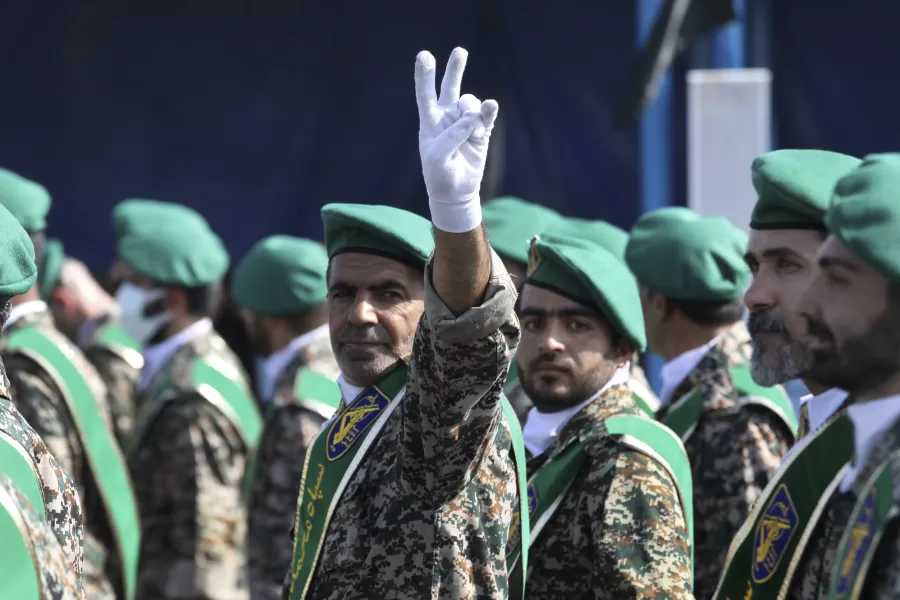 FILE – A member of Iran’s Basij paramilitary force flashes a victory sign during a military parade outside of Tehran, Iran, on Sept. 22, 2022. (AP Photo/Vahid Salemi, File)