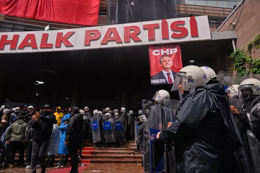 Police officers stand at Turkey’s main opposition Republican People’s Party (CHP) headquarters after entering to evict supporters gathered inside for party leader Ozgur Ozel, in Ankara, Sunday, May 24, 2026. (AP Photo/Ali Unal)