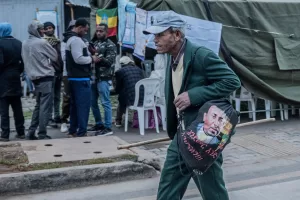 A voter carrying a bag bearing a picture of Ethiopia’s Prime Minister Abiy Ahmed walks to cast his vote at the Gerji Robe polling station in Addis Ababa, Ethiopia, Monday, June 1, 2026. (AP Photo/Amanuel Sileshi)