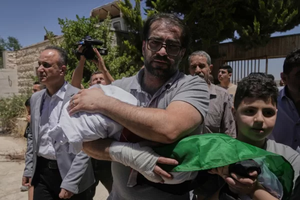 Fahd Abu Haikal, 41 carries the body of his seven month old Palestinian baby boy Sam, who was killed on Friday when, according to the Palestinian health ministry, Israeli soldiers fired at the vehicle carrying him and his parents in Tel Rumeida, during his funeral in the West Bank city of Hebron, Saturday, June 6, 2026. (AP Photo/Mahmoud Illean) Fahd Abu Haikal, 41 carries the body of his seven month old Palestinian baby boy Sam, who was killed on Friday when, according to the Palestinian health ministry, Israeli soldiers fired at the vehicle carrying him and his parents in Tel Rumeida, during his funeral in the West Bank city of Hebron, Saturday, June 6, 2026. (AP Photo/Mahmoud Illean)
