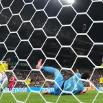 Tunisia goalkeeper Mouhib Chamakh (1) fails to stop a goal from Sweden’s Mattias Svanberg (19) during the World Cup Group F soccer match between Sweden and Tunisia in Guadalupe, near Monterrey, Mexico, Sunday, June 14, 2026. (AP Photo/Matias Delacroix)