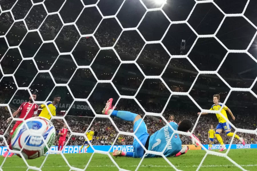 Tunisia goalkeeper Mouhib Chamakh (1) fails to stop a goal from Sweden’s Mattias Svanberg (19) during the World Cup Group F soccer match between Sweden and Tunisia in Guadalupe, near Monterrey, Mexico, Sunday, June 14, 2026. (AP Photo/Matias Delacroix)