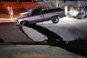 A vehicle is trapped in a fissure caused by an earthquake in La Guaira, Venezuela, Thursday, June 25, 2026. (AP PhotoJavier Campos) A vehicle is trapped in a fissure caused by an earthquake in La Guaira, Venezuela, Thursday, June 25, 2026. (AP PhotoJavier Campos)