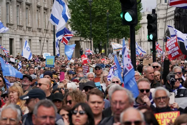 Demonstrators gather holding flags and placards as they attend a protest against antisemitism and extremism, in London, Sunday, May 10, 2026.(AP Photo/Alberto Pezzali)