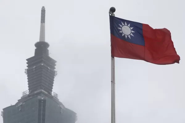 FILE – A Taiwan national flag flutters near the Taipei 101 building at the National Dr. Sun Yat-Sen Memorial Hall in Taipei, Taiwan, May 7, 2023. (AP Photo/Chiang Ying-ying, File)