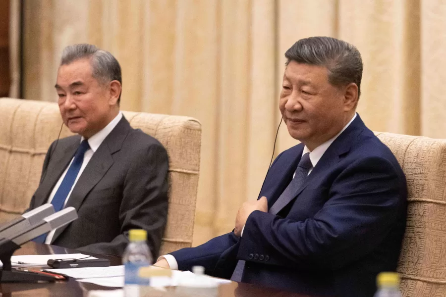 Chinese President Xi Jinping, right and Chinese Foreign Minister Wang Yi attend a meeting with German Chancellor Friedrich Merz, not pictured, at the Diaoyutai State Guesthouse in Beijing, China, Wednesday Feb. 25, 2026.(Jessica Lee/Pool Photo via AP)