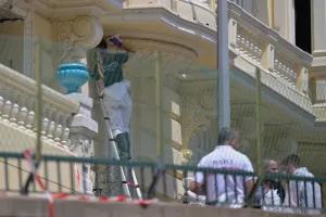 An investigator examines the scene at the residential building where an explosive device seriously injured three people a day earlier in Monaco, Tuesday, June 30, 2026. (AP Photo/Philippe Magoni) An investigator examines the scene at the residential building where an explosive device seriously injured three people a day earlier in Monaco, Tuesday, June 30, 2026. (AP Photo/Philippe Magoni)