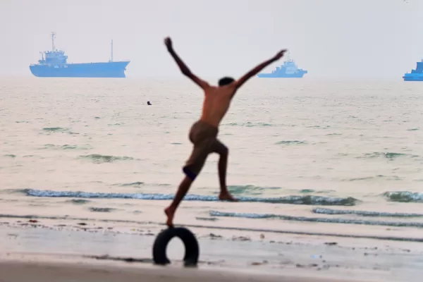 A boy balances on a tire at the water’s edge as ships are seen in the Strait of Hormuz off Bandar Abbas, Iran, Tuesday, June 30, 2026. (Amirhosein Khorgooi/ISNA via AP) A boy balances on a tire at the water’s edge as ships are seen in the Strait of Hormuz off Bandar Abbas, Iran, Tuesday, June 30, 2026. (Amirhosein Khorgooi/ISNA via AP)
