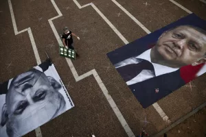 A woman takes part in a protest against Israeli Prime Minister Benjamin Netanyahu, seen on the poster left while Turkish President Recep Tayyip Erdogan is on the other poster, in Tel Aviv, Israel, Sunday, April 19, 2020. The demonstrators accused Netanyahu of using the coronavirus crisis as cover to undermine the country’s democratic institutions. (AP Photo/Oded Balilty) A woman takes part in a protest against Israeli Prime Minister Benjamin Netanyahu, seen on the poster left while Turkish President Recep Tayyip Erdogan is on the other poster, in Tel Aviv, Israel, Sunday, April 19, 2020. The demonstrators accused Netanyahu of using the coronavirus crisis as cover to undermine the country’s democratic institutions. (AP Photo/Oded Balilty)