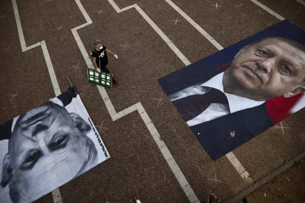 A woman takes part in a protest against Israeli Prime Minister Benjamin Netanyahu, seen on the poster left while Turkish President Recep Tayyip Erdogan is on the other poster, in Tel Aviv, Israel, Sunday, April 19, 2020. The demonstrators accused Netanyahu of using the coronavirus crisis as cover to undermine the country’s democratic institutions. (AP Photo/Oded Balilty) A woman takes part in a protest against Israeli Prime Minister Benjamin Netanyahu, seen on the poster left while Turkish President Recep Tayyip Erdogan is on the other poster, in Tel Aviv, Israel, Sunday, April 19, 2020. The demonstrators accused Netanyahu of using the coronavirus crisis as cover to undermine the country’s democratic institutions. (AP Photo/Oded Balilty)