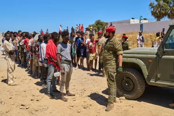 Migrants who crossed into Spain from Morocco line up for water distributed by Spanish soldiers in the Spanish enclave of Ceuta, Sunday, Aug. 2, 2026. (AP Photo/Bernat Armangue) Migrants who crossed into Spain from Morocco line up for water distributed by Spanish soldiers in the Spanish enclave of Ceuta, Sunday, Aug. 2, 2026. (AP Photo/Bernat Armangue)