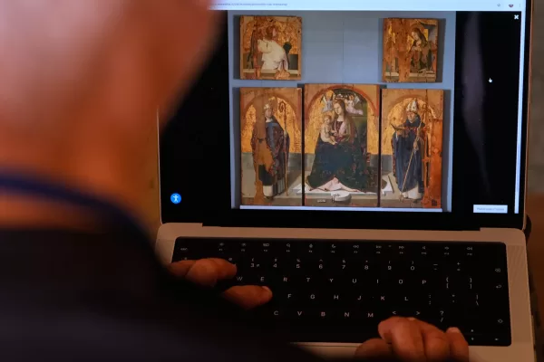 A journalist browses the Messina museum website showing a picture of the Early Renaissance painter Antonello da Messina’s artwork where three of the five panels belonging to the Polyptych of San Gregorio and the double-sided panel with the Madonna and the Christ in Pietà, stolen from the Sicilian museum on Aug. 15, in Rome, Sunday, Aug. 16, 2026. (AP Photo/Gregorio Borgia)





Associate Press/ LaPresse
Only Italy and Spain