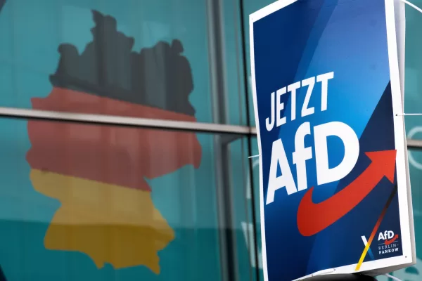 FILE – An election poster of the German far right Alternative for Germany party (AfD), right, is attached to a lamppost in front of a giant election poster showing a map of Germany, at the headquarters of the German Christian Democratic Union (CDU) in Berlin, Germany, Jan. 29, 2025. Slogan reads: ‘Now AfD’. (AP Photo/Michael Sohn, File) FILE – An election poster of the German far right Alternative for Germany party (AfD), right, is attached to a lamppost in front of a giant election poster showing a map of Germany, at the headquarters of the German Christian Democratic Union (CDU) in Berlin, Germany, Jan. 29, 2025. Slogan reads: ‘Now AfD’. (AP Photo/Michael Sohn, File)
