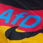 The logo of the “Alternative for Germany” (AfD) party is fixed on a German national flag for the state elections in Saxony-Anhalt during an election campaign event in Magdeburg, Germany, Friday, Sept. 4, 2026. (AP Photo/Matthias Schrader) 



Associated Press / Lapresse
Only italy and spain
