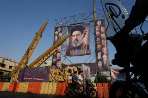 Motorbikes drive past Iranian missiles and banners showing portraits of the Iranian Supreme Leader Ayatollah Mojtaba Khamenei, center, and the late armed forces commanders and nuclear scientists, who were killed in Israeli and U.S. strikes, displayed in a military exhibition commemorating the anniversary of the start of the 1980-88 Iraq-Iran war at Baharestan Square, in Tehran, Monday, Sept. 28, 2026. (AP Photo/Vahid Salemi) Motorbikes drive past Iranian missiles and banners showing portraits of the Iranian Supreme Leader Ayatollah Mojtaba Khamenei, center, and the late armed forces commanders and nuclear scientists, who were killed in Israeli and U.S. strikes, displayed in a military exhibition commemorating the anniversary of the start of the 1980-88 Iraq-Iran war at Baharestan Square, in Tehran, Monday, Sept. 28, 2026. (AP Photo/Vahid Salemi)