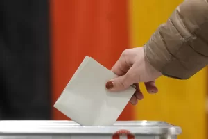 A resident casts a vote at a polling station in Berlin, Germany, Sunday, Feb. 23, 2025, during the German national election. (AP Photo/Michael Probst) A resident casts a vote at a polling station in Berlin, Germany, Sunday, Feb. 23, 2025, during the German national election. (AP Photo/Michael Probst)