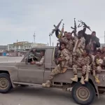 This image taken from undated video released by Al-Masirah TV, a channel owned by Yemen’s Houthi rebels, on Friday, Sept. 11, 2026, shows, according to the channel, Houthi fighters chanting atop a pickup truck in Khawkhah, Hodeida province, Yemen. (Al-Masirah TV via AP)