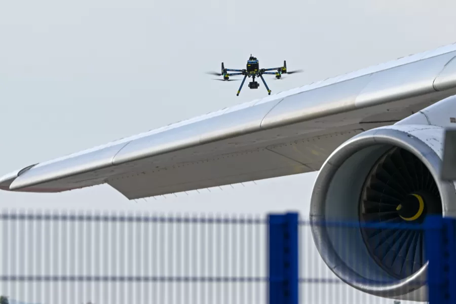 A police drone checks an aircraft at Leipzig/Halle Airport, where a drone with an explosive device was found and a detonator was removed from the object, in Schkeuditz, Germany, Wednesday Aug. 5, 2026. (Hendrik Schmidt/dpa via AP)