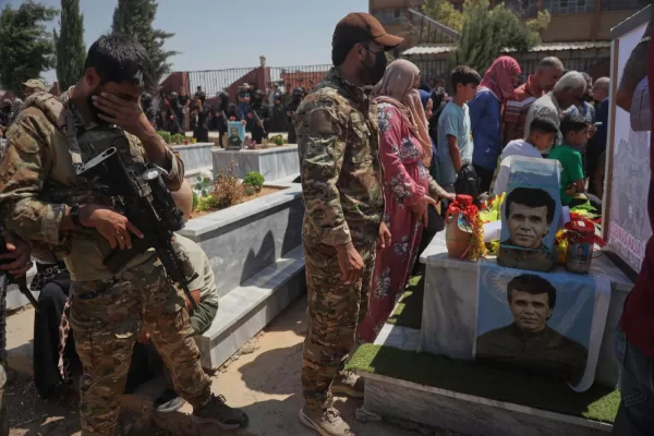 A member of the Syrian Army’s Qamishli Brigade mourns during the funeral of Kurdish fighters Artish Hassan and Shahin Suleiman, who were killed in an armed attack south of Qamishli Aug. 11, in Qamishli, northeastern Syria, Thursday, Aug. 13, 2026.(AP Photo/Baderkhan Ahmad)