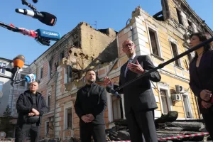 Ukraine’s President Volodymyr Zelenskyy, centre, and German Chancellor Friedrich Merz speak to media with National Academy of science building damaged after a Russian drone strike, on the background, Kyiv, Ukraine, Sunday, Oct. 4, 2026. (AP Photo/Evgeniy Maloletka) Ukraine’s President Volodymyr Zelenskyy, centre, and German Chancellor Friedrich Merz speak to media with National Academy of science building damaged after a Russian drone strike, on the background, Kyiv, Ukraine, Sunday, Oct. 4, 2026. (AP Photo/Evgeniy Maloletka)