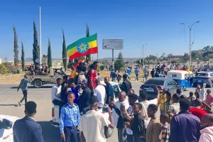 In this photo taken with a smartphone, supporters gather to welcome former Tigray leader Getachew Reda in Mekelle, Ethiopia, Sunday, Oct. 11, 2026. (AP Photo/Filmon Equar Hailu)